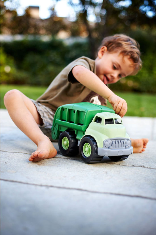 kids playing with toy trucks